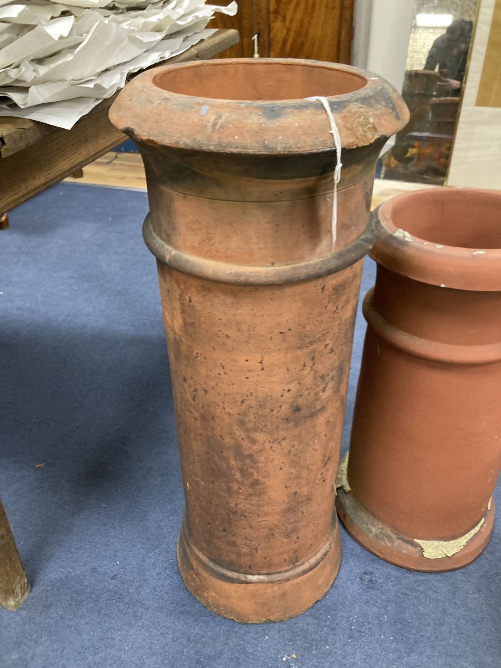 Two terracotta chimney pots, tallest 77cm